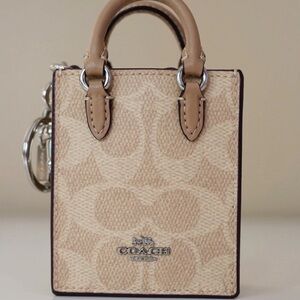 Coach North/South Mini Tote Bag Charm In Signature Canvas- Cream / Beige